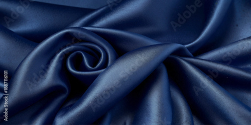 Luxurious Abstract Satin Silk Cloth Background with Blue Metallic Shine, Smooth Wavy Fabric Folds and Soft Flowing Liquid Waves Creating an Elegant Royal Textile Texture