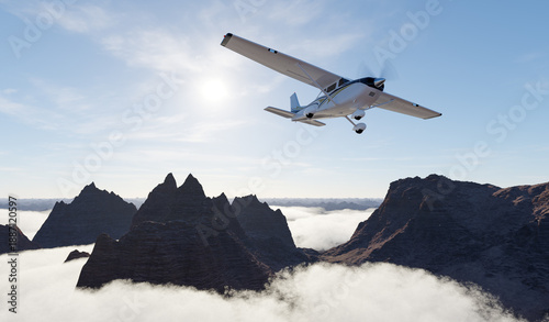 Wallpaper Mural Small Plane Flies Over Jagged Mountain Range Above Clouds At Sunrise Torontodigital.ca