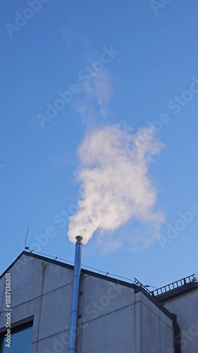 Smoke rising from chimney. Residential heating