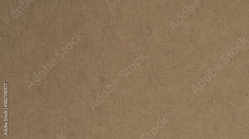 Close up of textured brown paper surface with subtle fibers and granular details