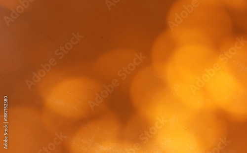 Festive background in orange tones with bokeh lights. Copy space 
