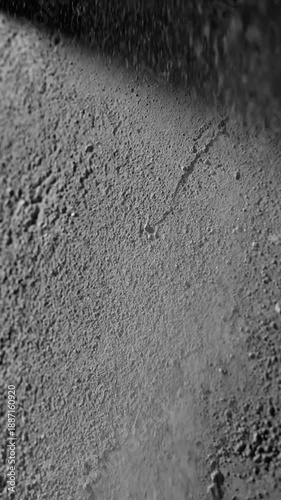 Dynamic Particle Cascade On Textured Gray Surface Loop Background Motion Element