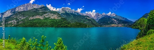 Aerial Landscape Molveno Lake Lago di Molveno Trentino Alpine Village with Turquoise Water and Dolomites Background