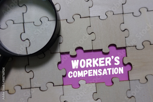 Worker compensation puzzle piece with magnifying glass