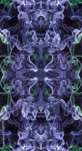 Symmetrical abstract pattern created from swirling blue and green ethereal smoke plumes against a dark background