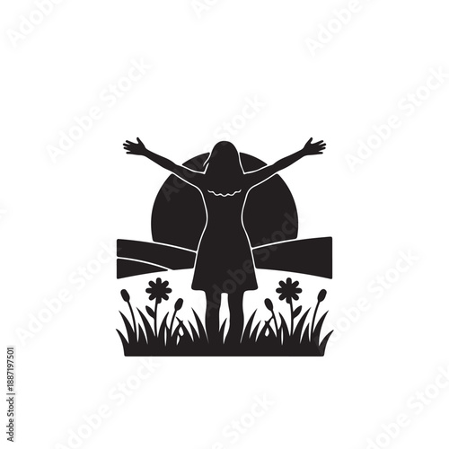 Silhouette of woman with arms outstretched at sunset