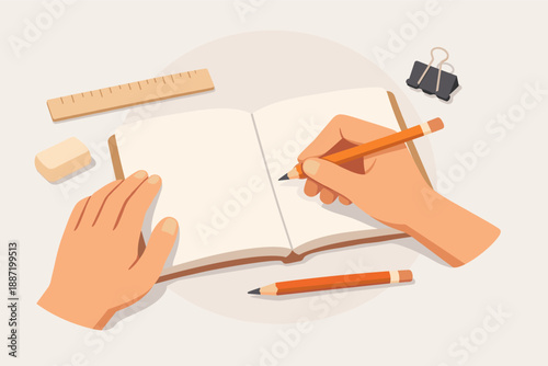 Hands writing in open notebook with pencil and stationery on desk