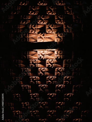 Terracotta wall tile texture with dramatic light