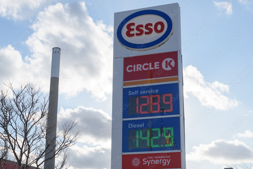 Naklejka premium tall roadside display showing the Esso brand name, Circle K, and fuel prices at 829 Lake Shore Blvd E, Toronto