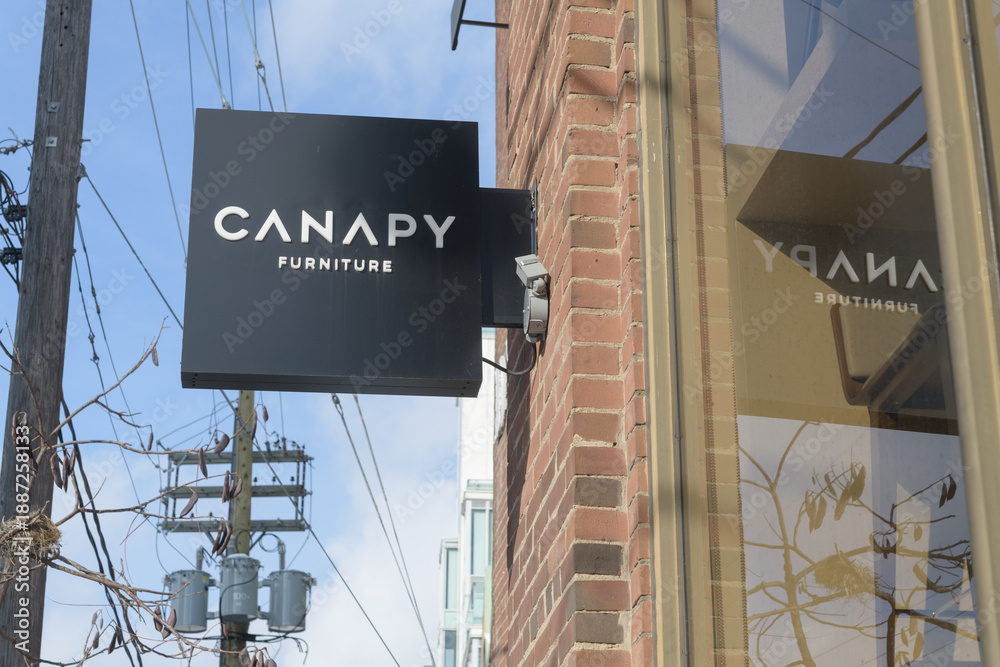 Fototapeta premium square projecting sign outside Canapy Furniture located at 326 Davenport Rd, Toronto