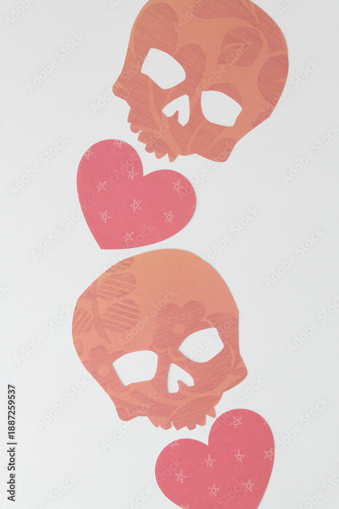 Fototapeta premium orange decor paper skulls with hearts