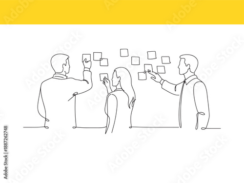 People collaborating and sharing ideas using sticky notes or cards