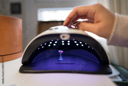 Home nail art setup featuring an LED lamp