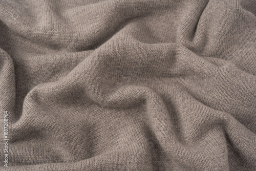 Soft grey merino wool sweater texture as a background.