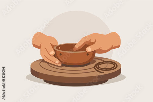 Hands shaping clay pot on pottery wheel