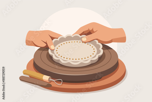 Hands crafting clay pottery on wheel with sculpting tool in studio