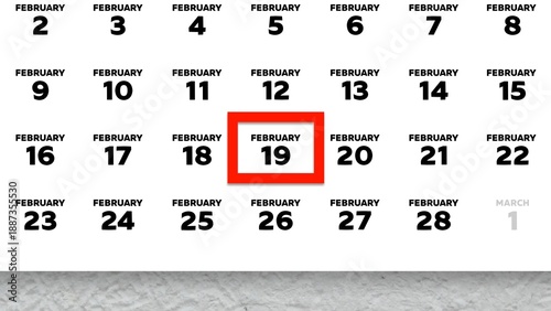 Foto Close-up of the date February 19th marked with a red cursor on the wall calendar