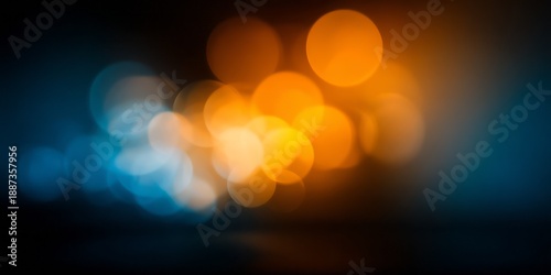 Soft orange and blue bokeh lights create a dreamy, abstract background effect.