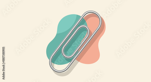 Metallic paperclip on abstract organic shapes, cream background