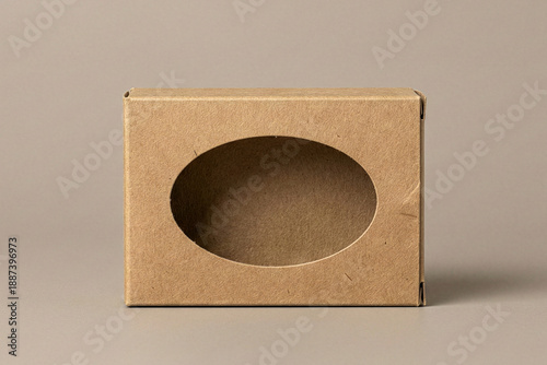 Front view of a brown cardboard box with an oval transparent window for product display