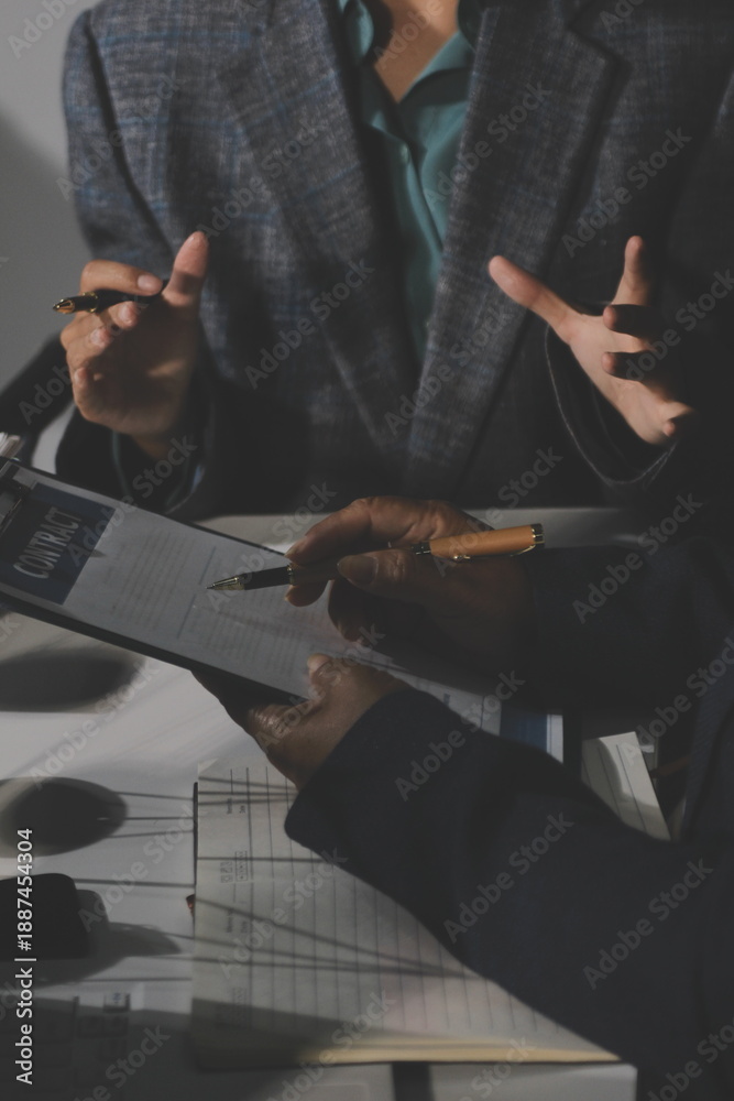 Fototapeta premium Businesswoman and Male lawyer or judge consult and conference having team meeting with client at law firm in office, Law and Legal services concept