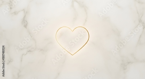 Elegant gold heart outline on white marble background