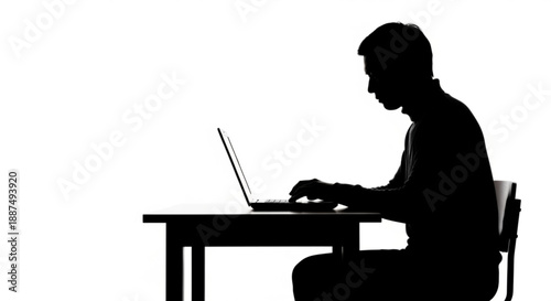 Silhouette of a focused individual diligently working on a laptop at a desk, illustrating deep concentration and the essence of digital productivity in the modern age