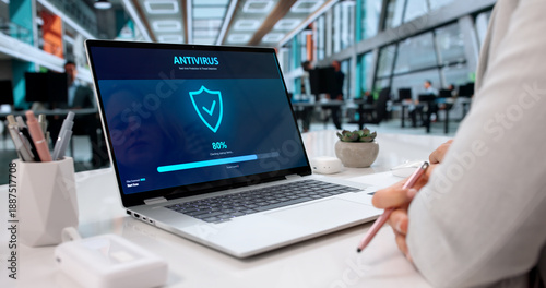 Tableau sur toile Woman Using Antivirus Software On Laptop To Prevent Cyber Attacks