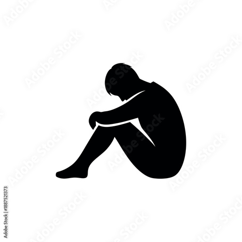 Silhouette of a person curled up in despair.