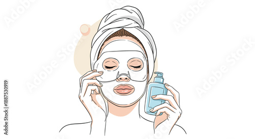 Beautiful young woman with a towel on her head applies a white cosmetic sheet face mask as part of her skincare routine.