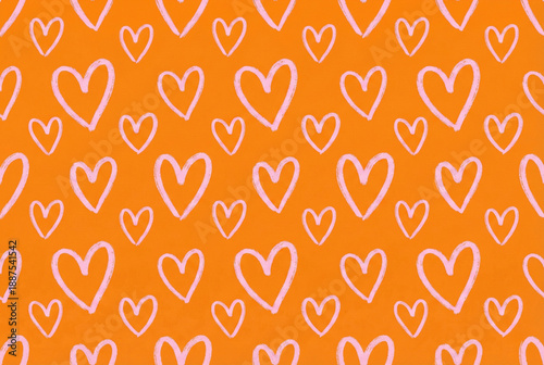 Seamless pink heart pattern on orange background for vibrant Valentine's Day design
