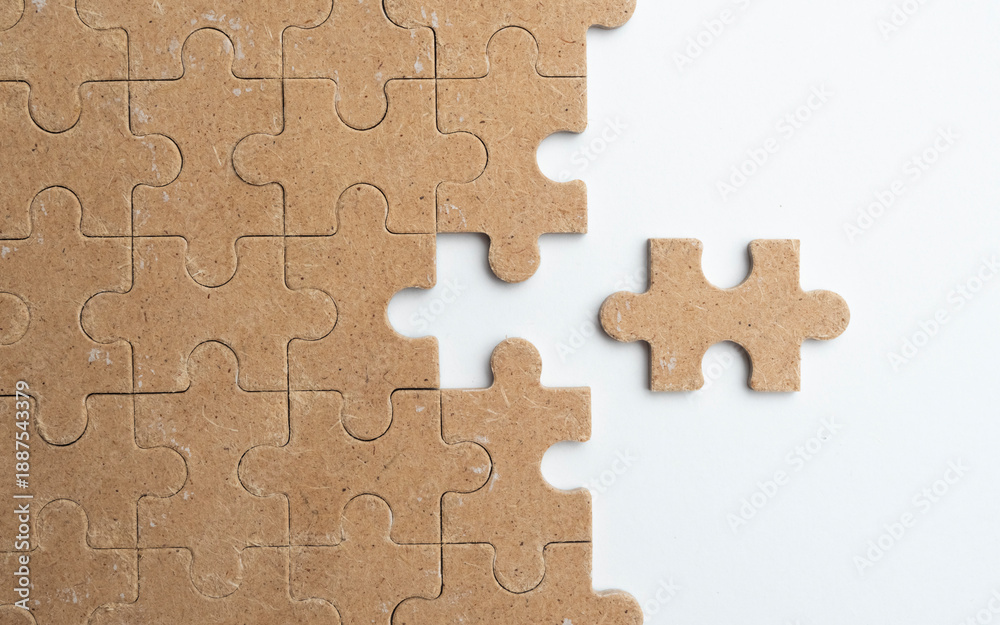 Fototapeta premium Wood Puzzle Pieces on white Background Representing Problem Solving