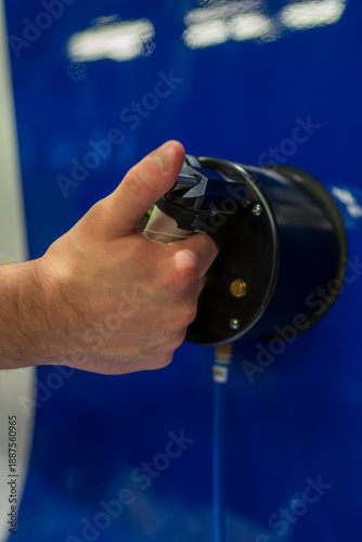 Hand testing aircraft rudder flexibility and elasticity during aviation maintenance quality inspection. Aerospace engineer examining aeroplane control surface deflection and structural response