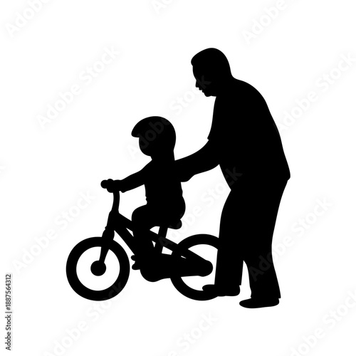 father teaching young son to ride a bicycle silhouette image