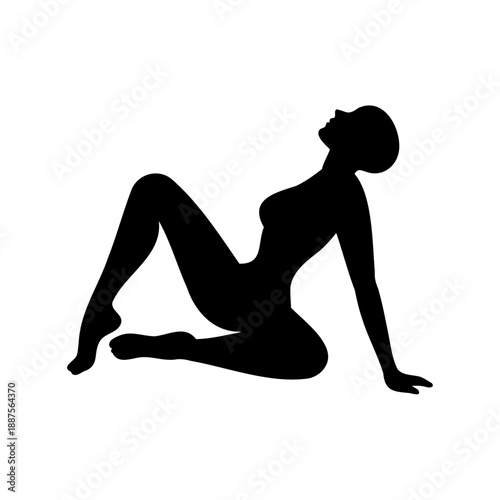 silhouette of a woman sitting on the floor with her legs bent