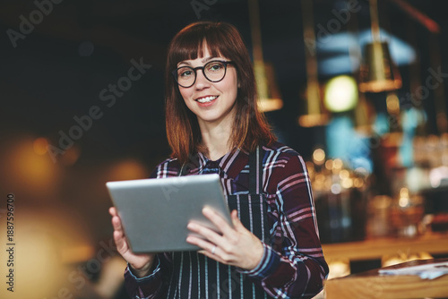 Φωτογραφία Portrait, woman and confident with tablet, cafe and digital reservation on web or happy with glasses