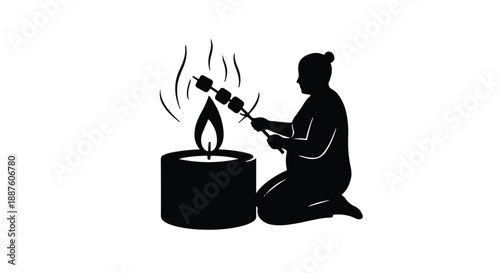 Person roasting marshmallows over a candle flame for a sweet treat
