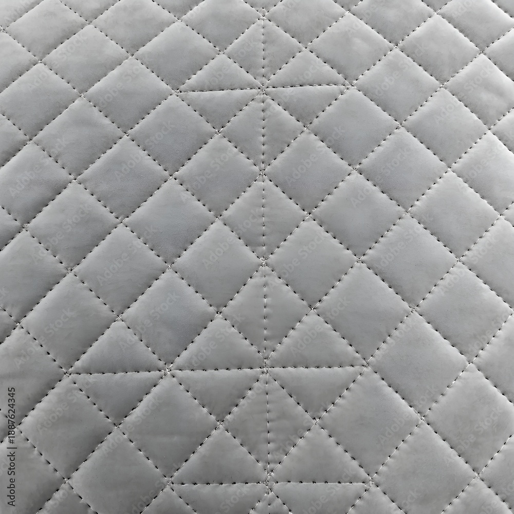 Fototapeta premium light grey velvet quilted fabric texture background with geometric diamond stitching