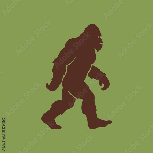 Silhouette of a Bigfoot or Sasquatch walking on a green background.