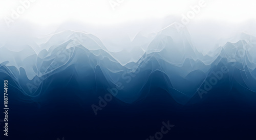 A hazy mountain range landscape with foggy atmosphere and dark blue shadows