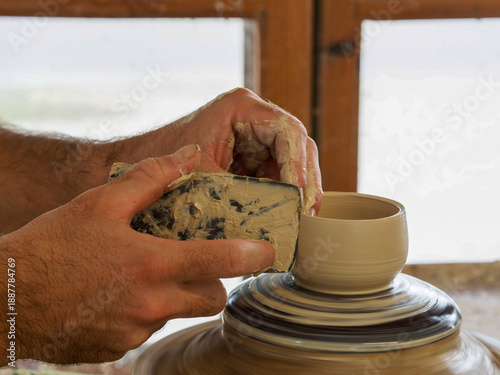 Hands Shaping Clay Bowl on Pottery Wheel