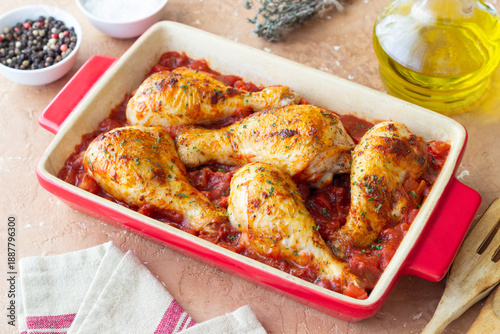 Baked chicken legs with tomatoes. Italian cuisine. Recipe.