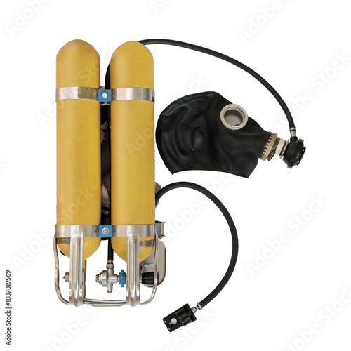 Early self-contained breathing apparatus with twin yellow air tanks, mounted on a metal frame, black rubber mask, regulator and hoses,used in firefighting and rescue operations, on a white background