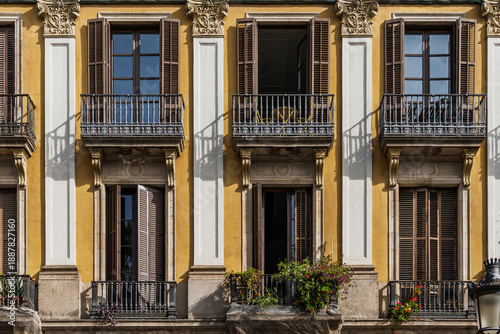 Photography Close Up of Ornate Mediterranean Balconies and Yellow Facade