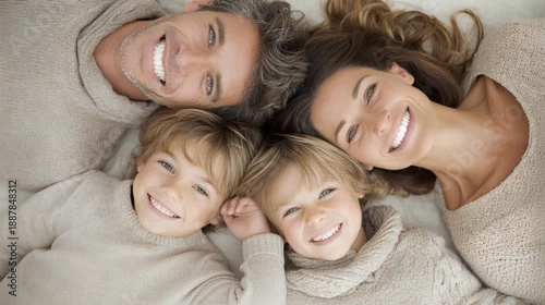 A big happy family lies in a circle and laughs. Close-up. Portrait of a happy family. View from above.