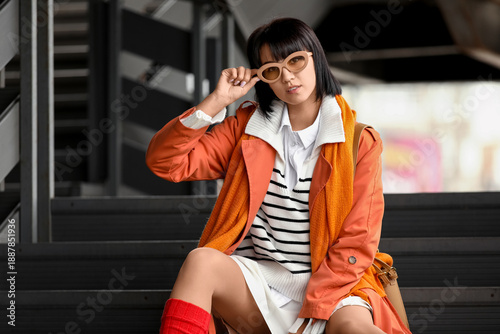 Stylish young woman wearing...