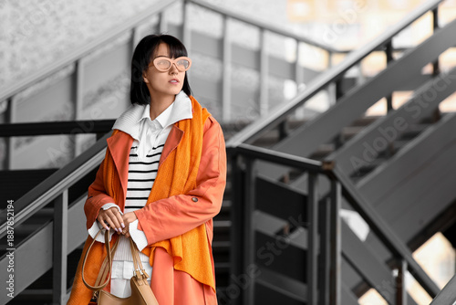 Stylish young woman wearing...