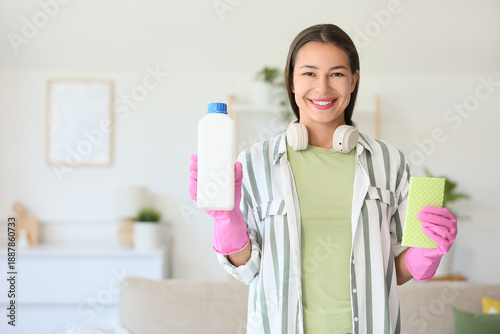 Young woman with rag and de...