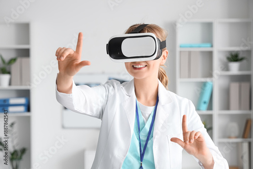 Female doctor in VR glasses using virtual screen at hospital