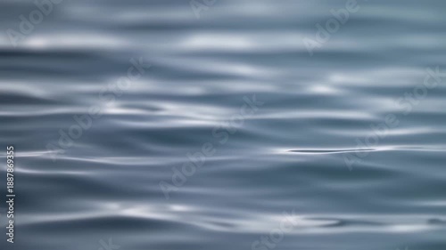 Aerial view of serene ocean waves gently rippling on a calm day in open sea